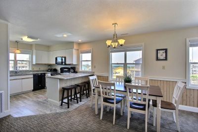 Dining area and kitchen at a Lighthouse View Oceanfront Lodging rental